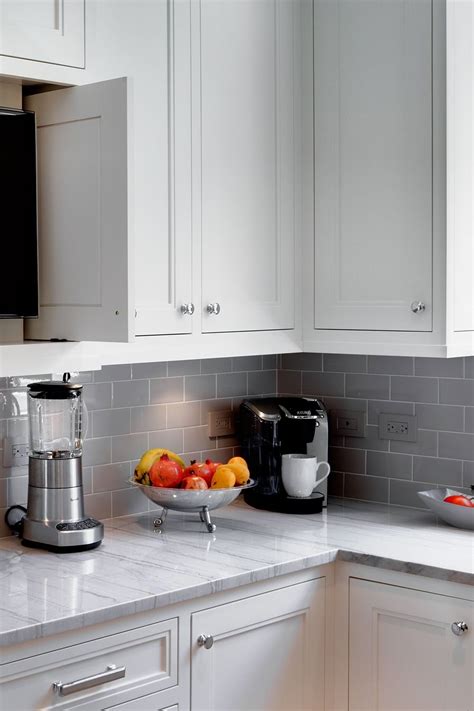 We have a list of 11 stunning quartz countertop colors that will be huge in 2020. White Macaubas Countertops Gray Backsplash White Cabinetry ...