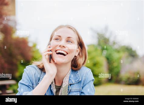 Laughing Woman Using Smartphone Hi Res Stock Photography And Images Alamy