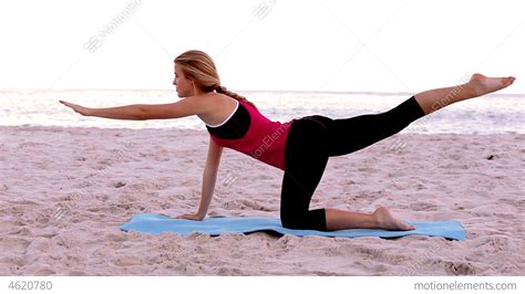 Blonde Woman Doing Pilates Stretches Stock Video Footage 4620780