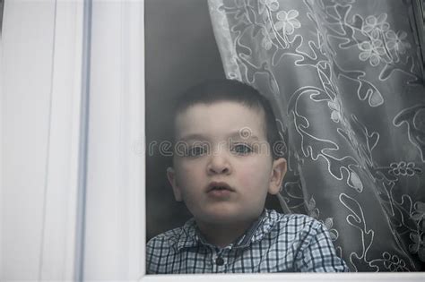 Sad Little Boy Behind A Window Look Sad Stock Image Image Of
