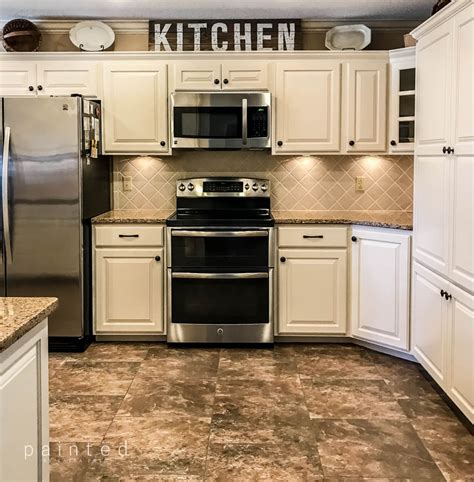 Paint kitchen walls a clean white to make soft brown oak cabinets stand. Bye Bye Honey Oak Kitchen Cabinets, Hello Brighter Kitchen! #honeyoakcabinets best white pai ...