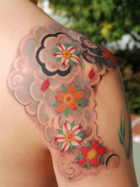 The colors of this tattoo have a bit of an unusual smudge to them. Blossom Tattoo: Chinese, Japanese Flower Designs-12 ...