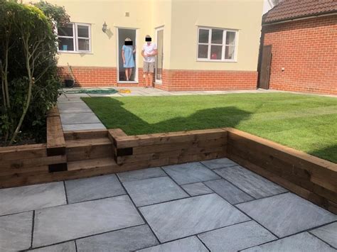 Indian Sandstone Patio With Sleeper Retaining Walls In Ongar Essex