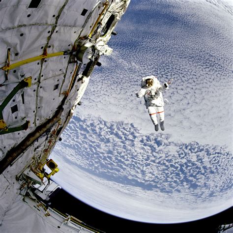 Apod 2001 October 2 A Flying Astronaut Over Earth