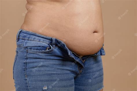 Premium Photo Overweighted Plumpy Lady With Flabby Stomach And Fat Sides Showing Waist In