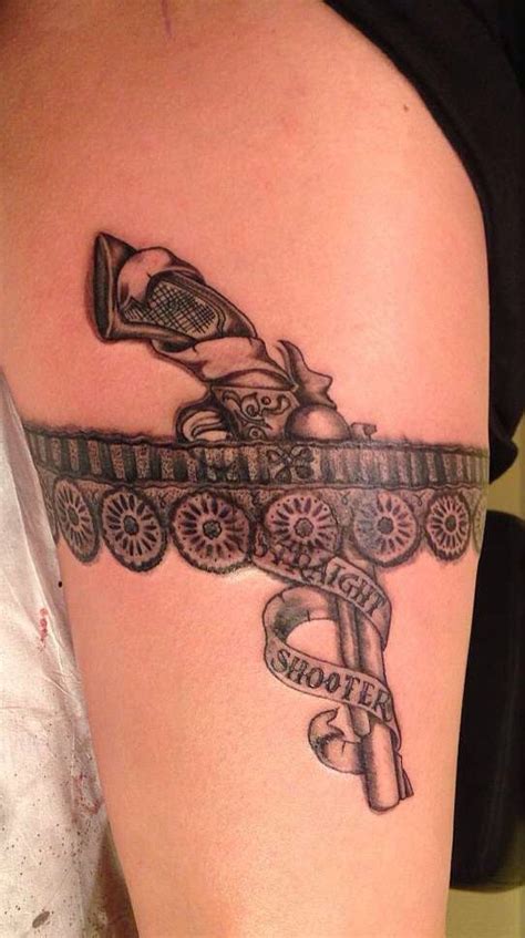 The inner part of slash's right forearm contains a tattoo of another silhouette of a girl, with a gun strapped to her thigh. Lace tattoo, Thigh tattoo designs, Thigh tattoo