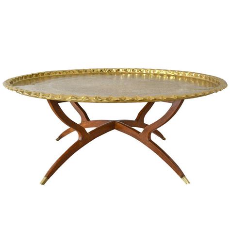 Aidy elevated the 70's tv tray and called it a coffee table. Round Brass Tray Top Coffee Table at 1stdibs