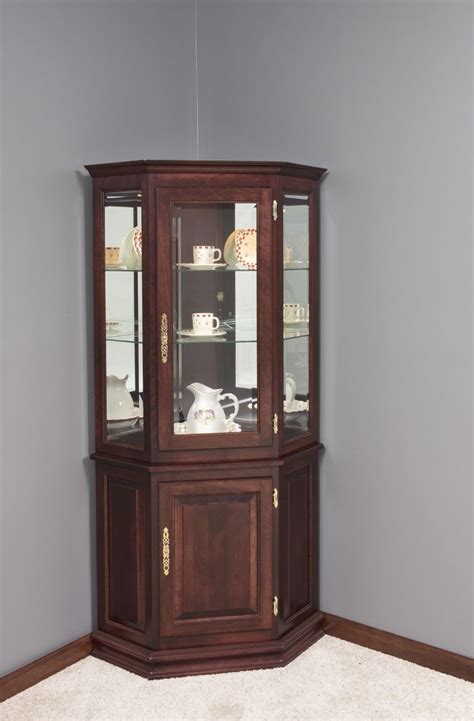 Display your collectibles with pride in this lighted curio cabinet. Corner Curio Cabinet With Drawers • Drawer Design