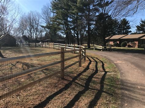 The split rail fence along my driveway. Locust Split Rail Fencing - Rustic - Landscape - Philadelphia - by Paramount Fencing