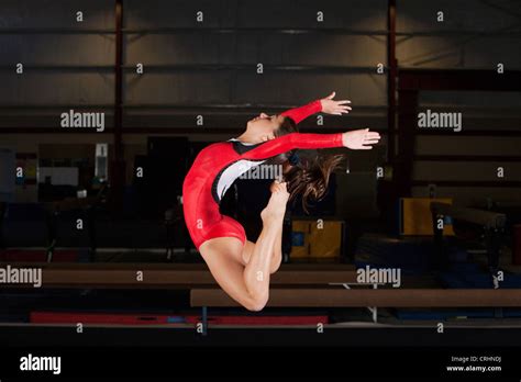 Gymnast Jumping In Air Bending Backwards Stock Photo Alamy