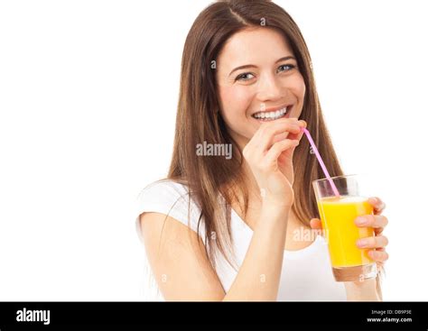 Portrait Of A Woman Drinking An Orange Juice With A Straw Isolated On
