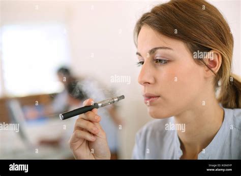 Portrait Of Woman Smoking With Electronic Cigarette Stock Photo Alamy