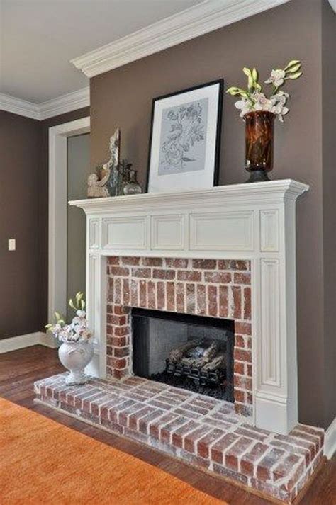 A Living Room With A Fireplace And Pictures On The Mantle