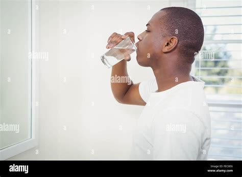Handsome Man Drinking Water Stock Photo Alamy