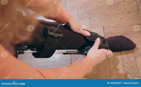 Lady Putting On Supportive Leg Brace Stock Image Image Of Flexible