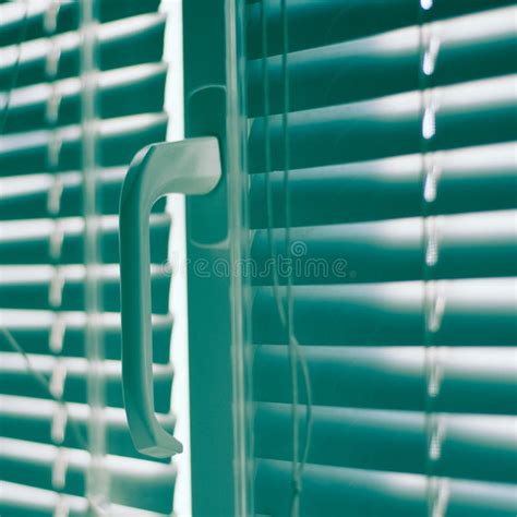 Closed Horizontal Blinds With Rope And Handle Green Tone Stock Image