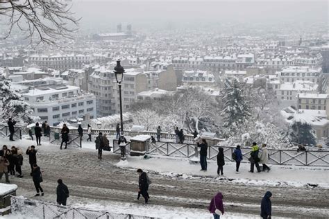 Rare Snow Brings Paris To Scenic Standstill