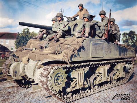 Us Infantry Riding On An M4 Sherman Tank Of The 33rd Armored Regiment