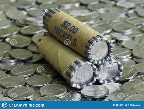Stack Of Nickel Rolls On A Pile Of Scattered Coins Stock Image Image