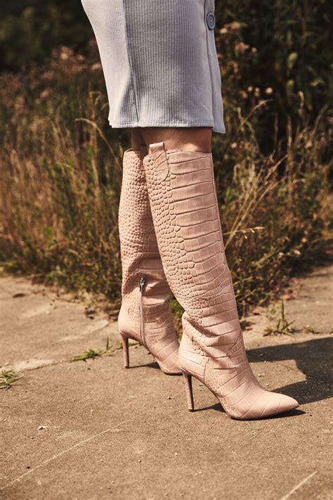 make a serious style statement with the kervana boot from vice camuto this croc print knee high