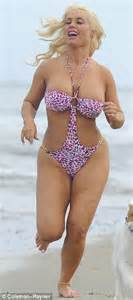 Cocos Dangerous Curves Threaten To Spill Out Of Her Flimsy Swimsuit As