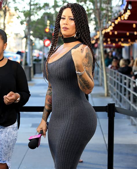 Photos Amber Rose Looks Beautiful In Corkscrew Locks Hairstyle In