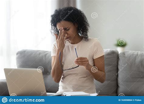 Exhausted African American Woman Taking Off Glasses Dry Eye Syndrome