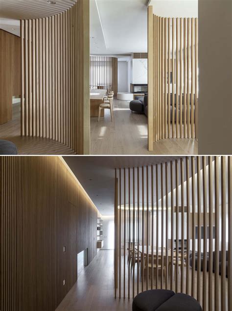 Oak Slat Walls Divide The Spaces Inside This Apartments Interior