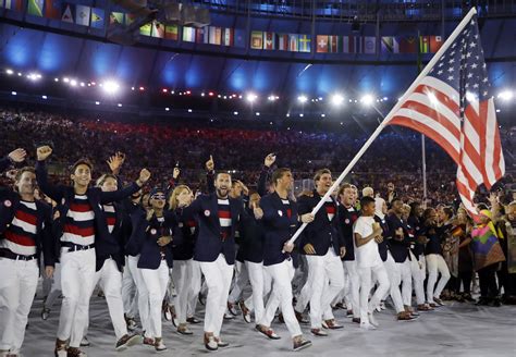 Michael Phelps Carries The Flag Of The United States During The Opening Ceremony For The 2016