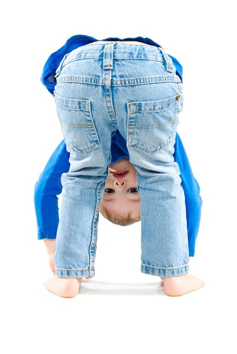 Portrait Of A Playful Child Standing Head Down Stock Photo Image Of