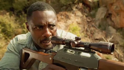 See A Bloodied Idris Elba On The Run From A Ferocious Beast