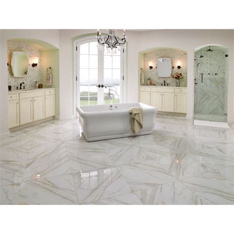 With its creamy white background that is gently infused with deep gray veining and the occasional ribbon of gold, it's a striking piece. Calacatta Gold 12X12 Honed Marble Tile - Tilesbay.com