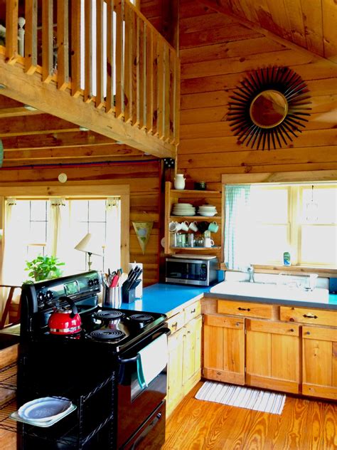 Make sure to dry the cabinets quickly after spraying them with the solution. The Pine Kitchen | Broadwing Farm Cabins