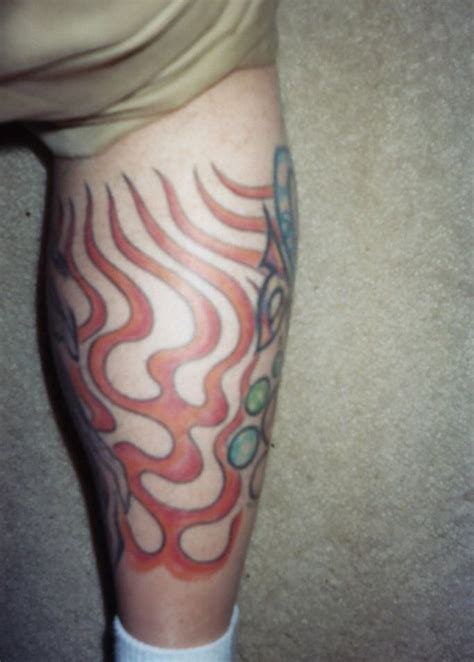 See more ideas about body art tattoos, traditional tattoo, traditional tattoo torch. Red Ink Tribal Fire Flame Tattoo On Back | Flame tattoos, Tattoo designs and meanings, Tattoos