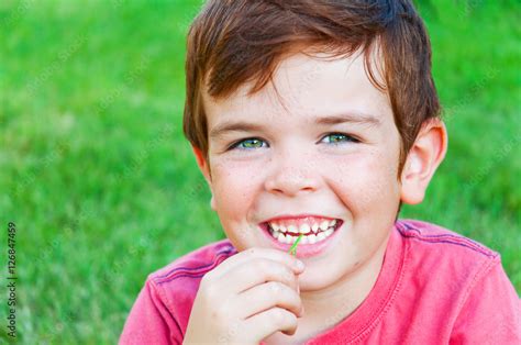 Portrait Of Cute Smiling Child Outdoors Stock Photo Adobe Stock