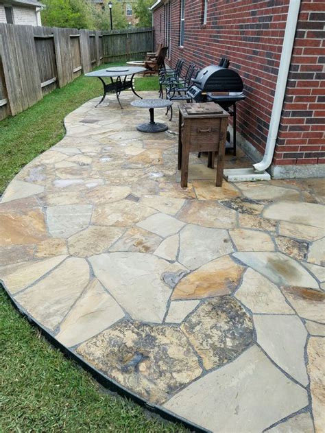 Bluestone doesn't always appear to wish to bond with mortar. Patio flagstone with crushed granite base, using grout ...