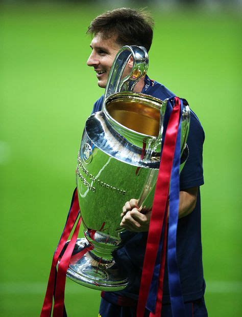 Lionel Messi Of Barcelona Lifts The Trophy During The Uefa Champions
