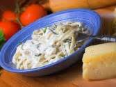 The alfredo sauce will harden into a thick paste once it cools in the fridge, but give it a few minutes of gentle heat on the stovetop or in the microwave, and it will once again become silky and creamy. Quick 'n' Tasty Sour Cream Alfredo Sauce Recipe from CDKitchen