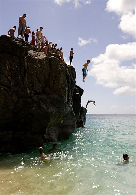 Cliff Jumping Into The Water In Hawaii Todd Bigelow Photography