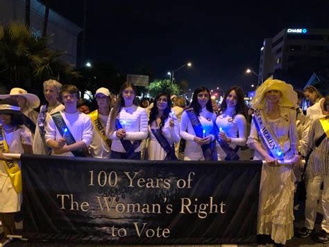 holiday parade march and celebrate the season and the 100th anniversary of women s suffrage
