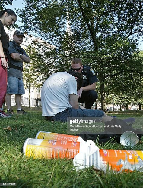 A Man On The Common Gets High By Huffing Canned Air The Four Cans