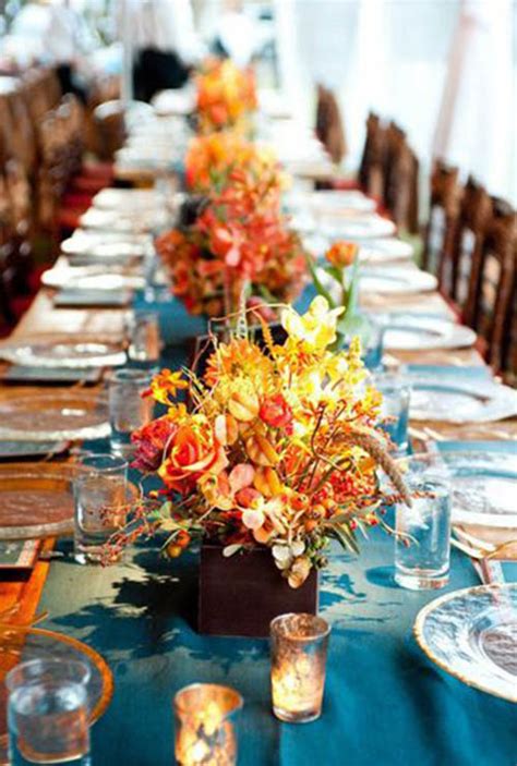 Very simple wedding table centrepieces can be vases of flowers in mason jars. 10 Lovely Fall Wedding Centerpieces! - B. Lovely Events