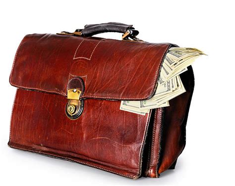 Suitcase Full Of Money Stock Photos Pictures And Royalty Free Images