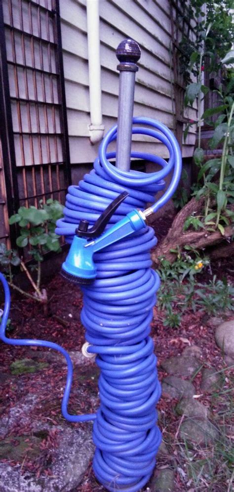 Simple Storage For A Coiled Hose To Prevent Kinking Conduit With A