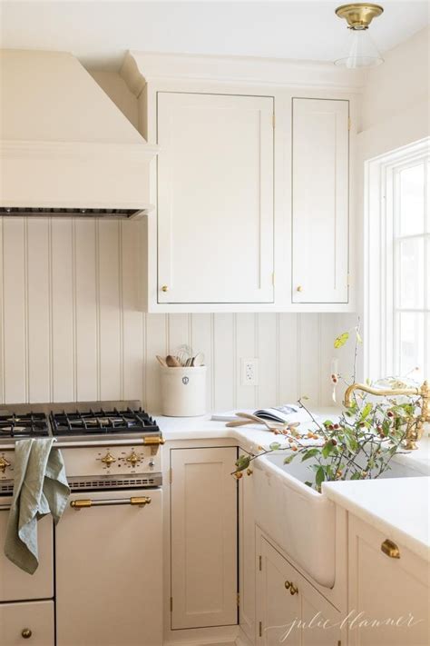 This classic kitchen in the picture above features beautifully carved wood panel cabinets painted in cream. New Kitchen Inspiration - A Cream Kitchen with Timeless Design