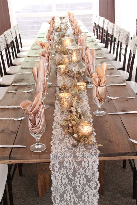A pretty lace table runner for a rustic wedding reception. | Lace
