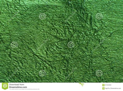 Green Foil Metallic Wall With Glowing Shiny Light Abstract Texture