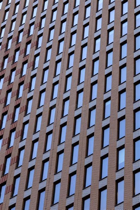 Facade Of A High Rise Brick Building With Windows Stock Image Image