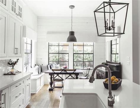 Black and white farmhouse kitchen makeover white painted cabinets dark grey counters and subway tile let s start with this striking black and white farmhouse kitchen. White Kitchen. Bronze Hardware. Black Accents. | White ...