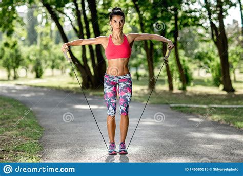 Photo Of It Young Woman Doing Push Up Exercise In The Park At The Sunse